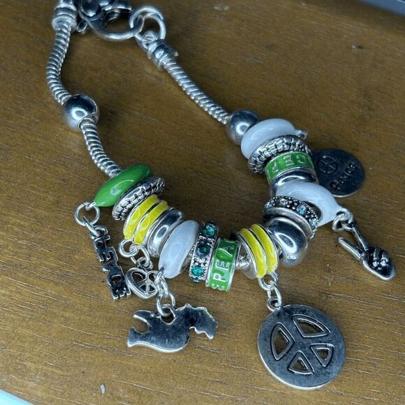 Jewelry Nexus Peace green yellow silver themed charm bracelet preowned - Picture 1 of 3